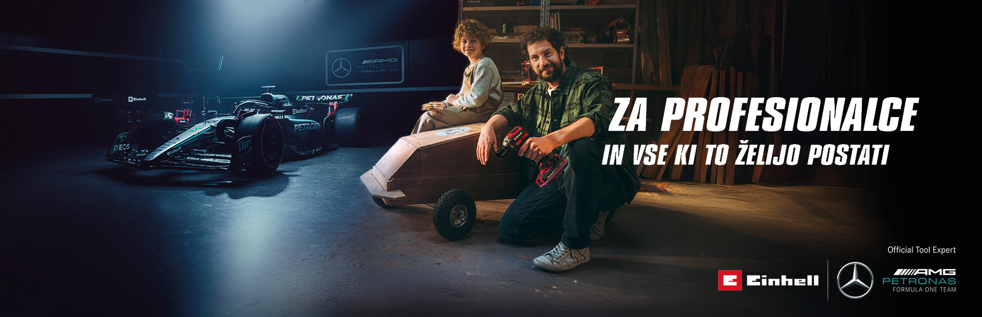 Oče in otrok v delavnici z doma narejeno avtomobilom na vozičku iz mila. V ozadju sta dirkalnik Mercedes-AMG PETRONAS Formula One in orodje Einhell. Na desni strani piše: "Za profesionalce in vse ki to želijo postati."