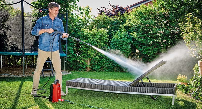 man working with a high pressure cleaner