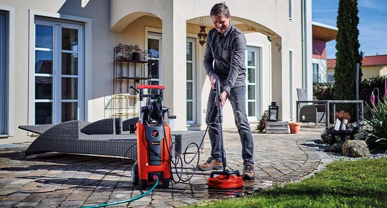 man using a high pressure cleaner